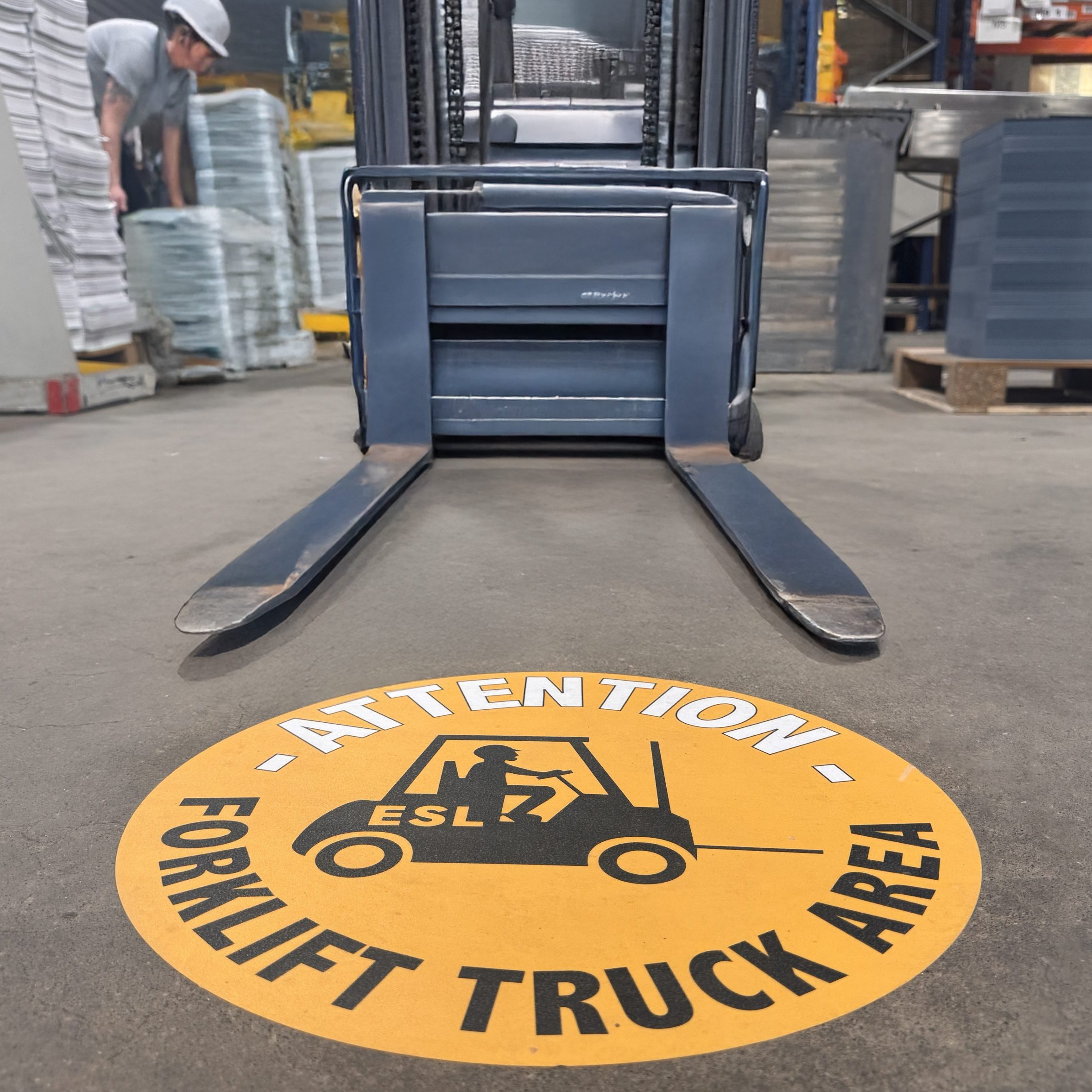 Floor sign in ESL Studio - warning staff of forklift activity